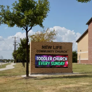 A monument sign that has an electronic message board built in.